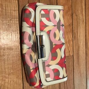 Coach clutch with wrist strap